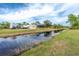 Peaceful canal view of property and neighborhood at 8099 Walbert St, Port Charlotte, FL 33981