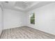 Simple bedroom with vinyl flooring and double door closet at 8099 Walbert St, Port Charlotte, FL 33981