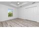 Light and airy bedroom with vinyl flooring and double door closet at 8099 Walbert St, Port Charlotte, FL 33981