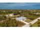 Single-story house with metal roof and a canal nearby at 8099 Walbert St, Port Charlotte, FL 33981