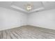 Simple bedroom with wood-look floors and an interior door at 8099 Walbert St, Port Charlotte, FL 33981