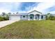 New construction home with metal roof and attached garage at 8099 Walbert St, Port Charlotte, FL 33981
