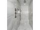 Large walk-in shower with multiple shower heads and tile surround at 8099 Walbert St, Port Charlotte, FL 33981