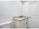 Clean bathroom with a marble vanity and a white toilet at 8099 Walbert St, Port Charlotte, FL 33981