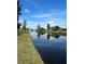 Peaceful waterfront view of a canal with lush green landscaping at 72 Boundary Blvd # 224, Rotonda West, FL 33947