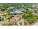 Aerial view of house, pool, and neighborhood at 9293 Panama Cir, Port Charlotte, FL 33981