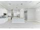 Modern kitchen with white cabinets, granite counters, and island at 9293 Panama Cir, Port Charlotte, FL 33981
