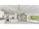 Open concept kitchen, Gathering room, and pool view at 9293 Panama Cir, Port Charlotte, FL 33981