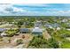 Aerial view showcasing house, pool, and surrounding area at 9293 Panama Cir, Port Charlotte, FL 33981