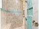 Walk-in shower with beautiful tile and glass accents at 9293 Panama Cir, Port Charlotte, FL 33981