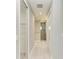 Walk-through bathroom with walk-in closet and access to the shower at 9293 Panama Cir, Port Charlotte, FL 33981