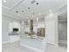 Island kitchen with white cabinets and granite countertops at 9293 Panama Cir, Port Charlotte, FL 33981