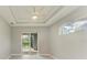 Bright bedroom with sliding glass doors to lanai and pool at 14999 Wichita Rd, Port Charlotte, FL 33981
