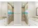 Double walk-in showers with mosaic tile accents at 14999 Wichita Rd, Port Charlotte, FL 33981