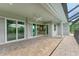 Extended patio with access to kitchen and pool area with screened enclosure at 14999 Wichita Rd, Port Charlotte, FL 33981