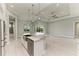 Island kitchen open to Gathering room, with access to pool at 14999 Wichita Rd, Port Charlotte, FL 33981