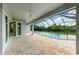 Covered patio overlooking a refreshing pool with a screened enclosure at 14999 Wichita Rd, Port Charlotte, FL 33981