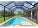 Inviting screened-in pool with a spacious deck at 14999 Wichita Rd, Port Charlotte, FL 33981