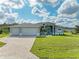 Single-Gathering home with three car garage and paver driveway at 14999 Wichita Rd, Port Charlotte, FL 33981