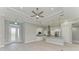 Open kitchen with white cabinets, granite counters, and stainless steel appliances at 14999 Wichita Rd, Port Charlotte, FL 33981