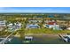 Aerial view of waterfront home with a large backyard and private dock at 12440 Placida Rd, Placida, FL 33946