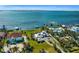 Aerial view of waterfront home with private dock and lush landscaping at 12440 Placida Rd, Placida, FL 33946