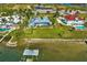 Aerial view of waterfront home with private dock and lush landscaping at 12440 Placida Rd, Placida, FL 33946