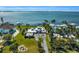 Aerial view of waterfront home with private dock and lush landscaping at 12440 Placida Rd, Placida, FL 33946