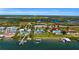 Aerial view of waterfront property with multiple homes and private docks at 12440 Placida Rd, Placida, FL 33946