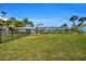 Large grassy backyard, offering plenty of space for outdoor activities at 12440 Placida Rd, Placida, FL 33946