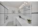 Simple bathroom with white tile and a shower/tub combo at 12440 Placida Rd, Placida, FL 33946