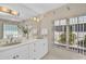 Bright bathroom with double vanity and natural light at 12440 Placida Rd, Placida, FL 33946