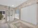 Spa-like bathroom with a shower and soaking tub, and a large window at 12440 Placida Rd, Placida, FL 33946