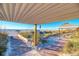 Beach walkway leads to shaded seating areas and picnic tables at 12440 Placida Rd, Placida, FL 33946