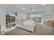 Bright bedroom with white furniture and water views at 12440 Placida Rd, Placida, FL 33946