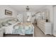 Bedroom with ensuite bathroom access and ceiling fan at 12440 Placida Rd, Placida, FL 33946