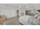 Main bedroom with ensuite bathroom and access to patio at 12440 Placida Rd, Placida, FL 33946