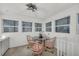 Bright breakfast nook with glass table and pink chairs at 12440 Placida Rd, Placida, FL 33946