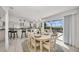 Bright dining area with water views and open kitchen access at 12440 Placida Rd, Placida, FL 33946