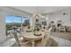 Casual dining area with water views and access to the living room and kitchen at 12440 Placida Rd, Placida, FL 33946