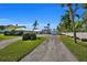Luxury waterfront home with a long private driveway and lush landscaping at 12440 Placida Rd, Placida, FL 33946