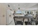 Well-equipped kitchen with breakfast bar, granite counters, and pool view at 12440 Placida Rd, Placida, FL 33946