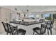 Spacious kitchen with an island, granite countertops, and backyard access at 12440 Placida Rd, Placida, FL 33946