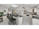 Modern kitchen with breakfast bar, ample counter space, and water views at 12440 Placida Rd, Placida, FL 33946