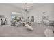 Living room with spiral staircase and water view at 12440 Placida Rd, Placida, FL 33946