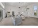 Spacious living area featuring a spiral staircase and ample natural light at 12440 Placida Rd, Placida, FL 33946
