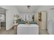 Living room features teal couch and built-in storage at 12440 Placida Rd, Placida, FL 33946