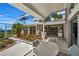 Screened patio overlooking the water with outdoor seating at 12440 Placida Rd, Placida, FL 33946