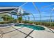 Screened-in pool and spa area with a waterfront view at 12440 Placida Rd, Placida, FL 33946
