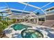 Large pool and spa with a screened patio and view at 12440 Placida Rd, Placida, FL 33946